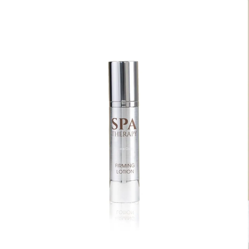 Close-up of a tall, silver cylindrical bottle labeled Spa Therapy Firming Lotion against a white background.