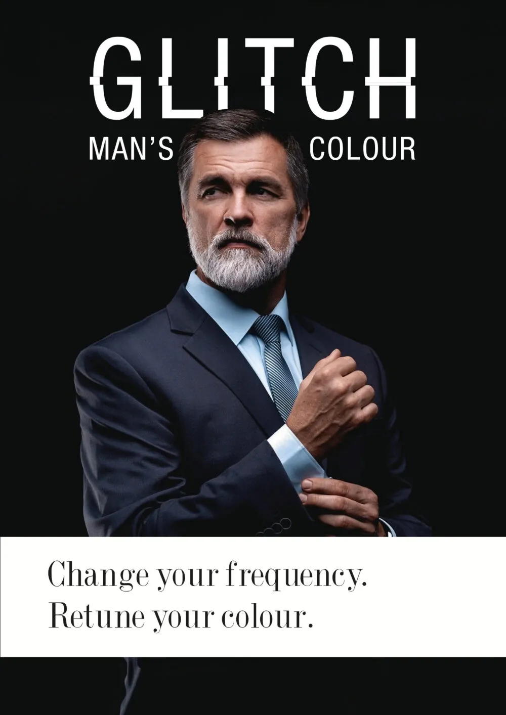 Portrait of a man in a dark suit with a white beard, overlaid by bold 'GLITCH' text and 'MAN'S COLOUR' on a black background.