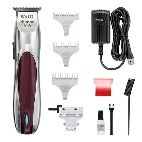 Wahl cordless hair trimmer with multiple guide combs and accessories (charger, oil, brush).