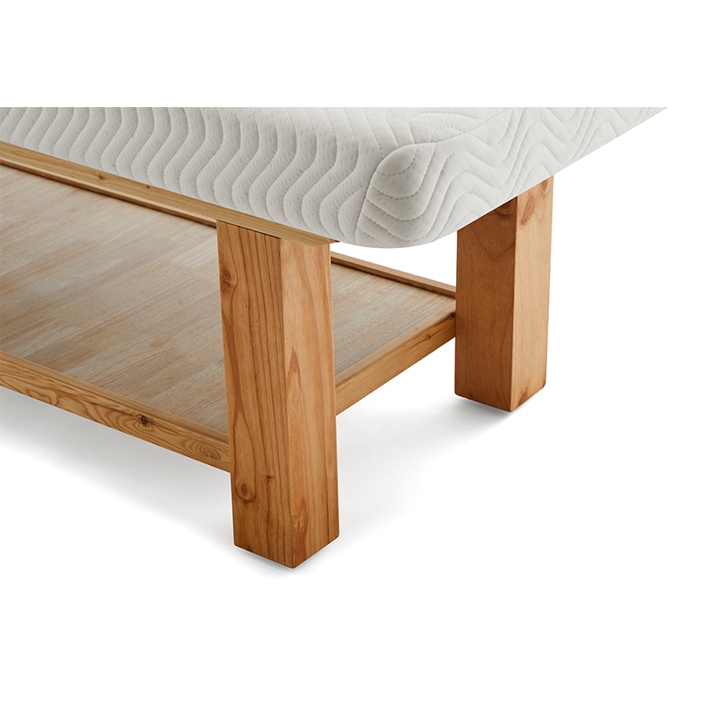 1-1png – Rapple Corner view of a wooden bed frame with a white quilted mattress on top, showcasing sturdy square legs.
