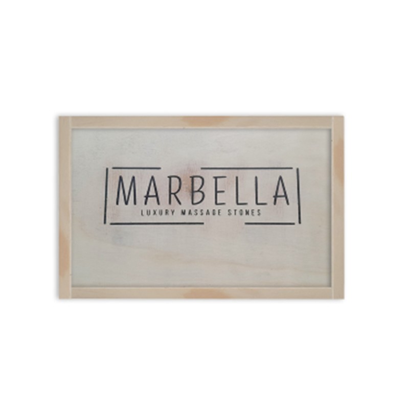 Hot_stone_set_40pc-1jpg โ Rapple Framed sign reading 'MARBELLA' with subtitle 'Luxury Massage Stones' in a light wooden frame