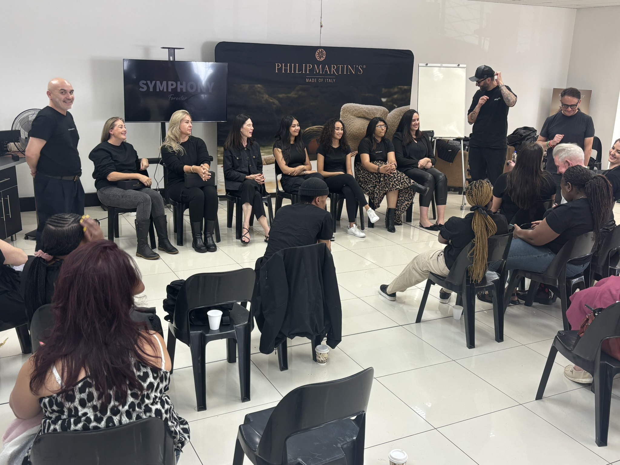 Stylists gathered around a live demonstration