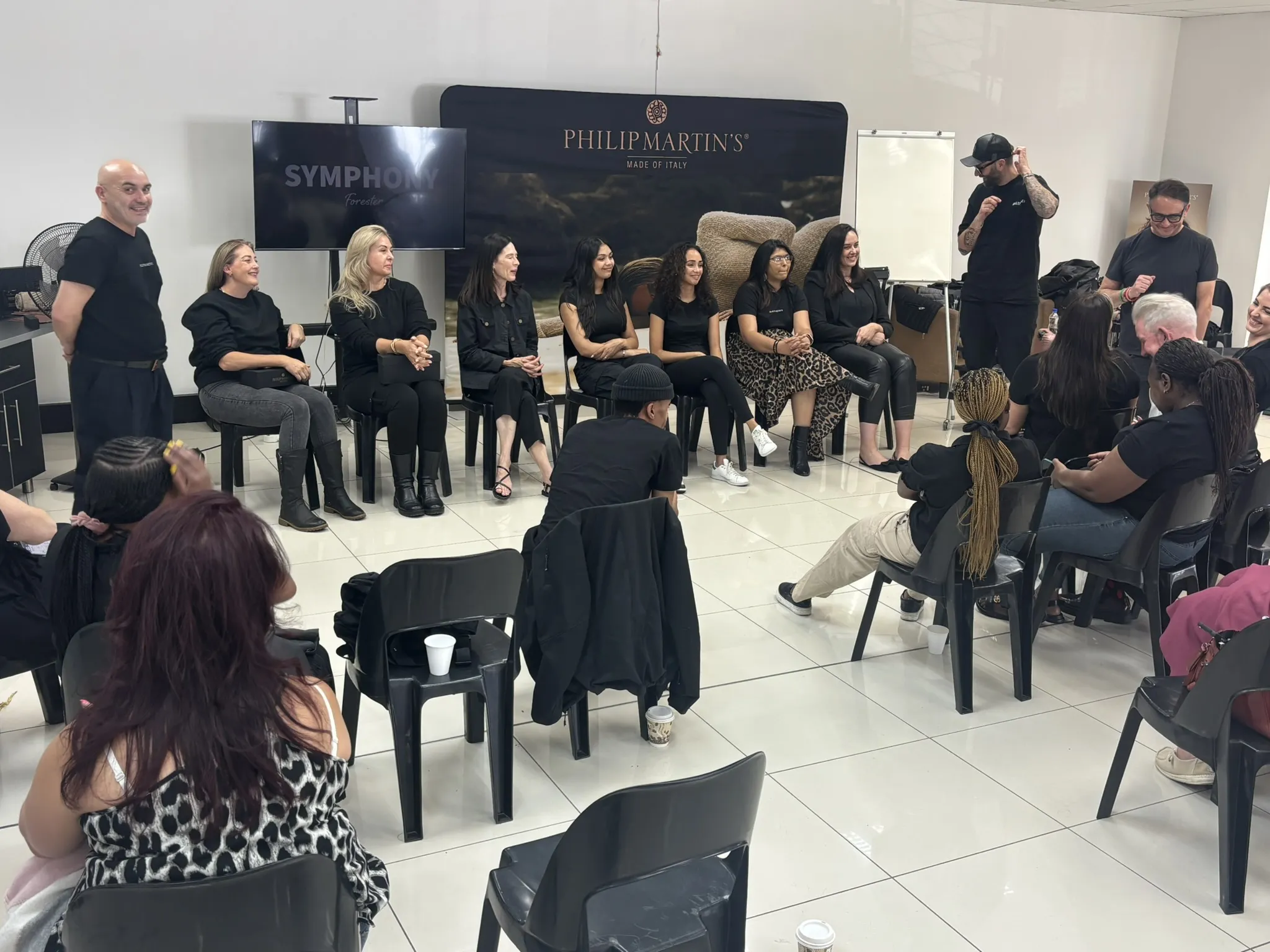 Stylists gathered around a live demonstration