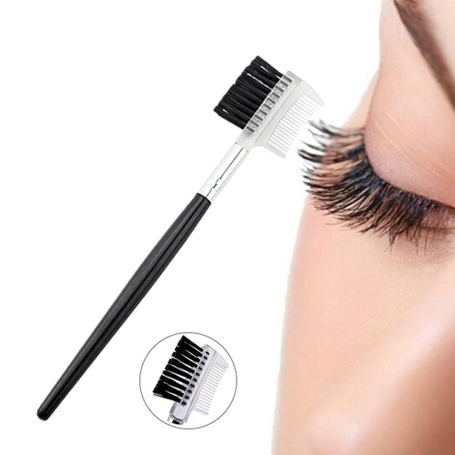 NFBMAKUNB007jpg โ Rapple Dual-ended eyelash brush and comb for applying mascara and separating lashes near the eye, with a long black handle and white bristle head.