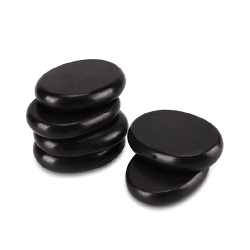 hot_stone_6pcjpg – Rapple Stack of smooth black massage stones arranged in a small pyramid on a white background.