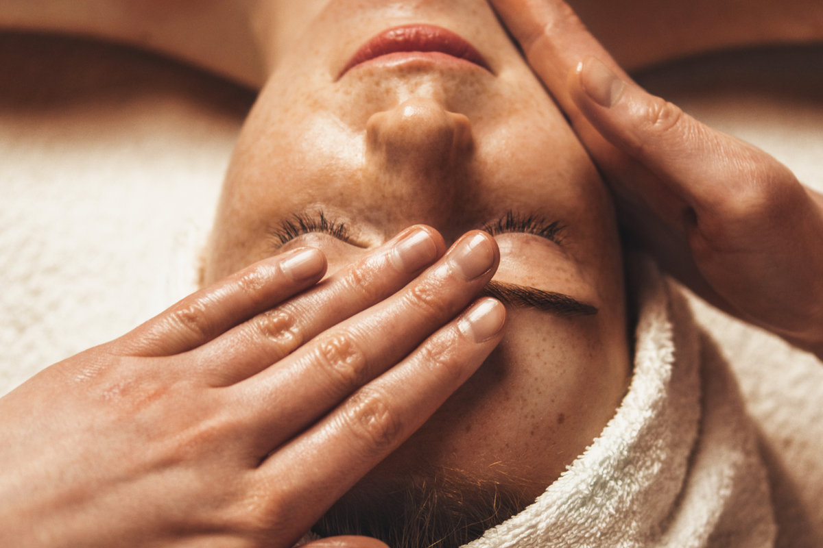 Man receiving a face and scalp ritual
