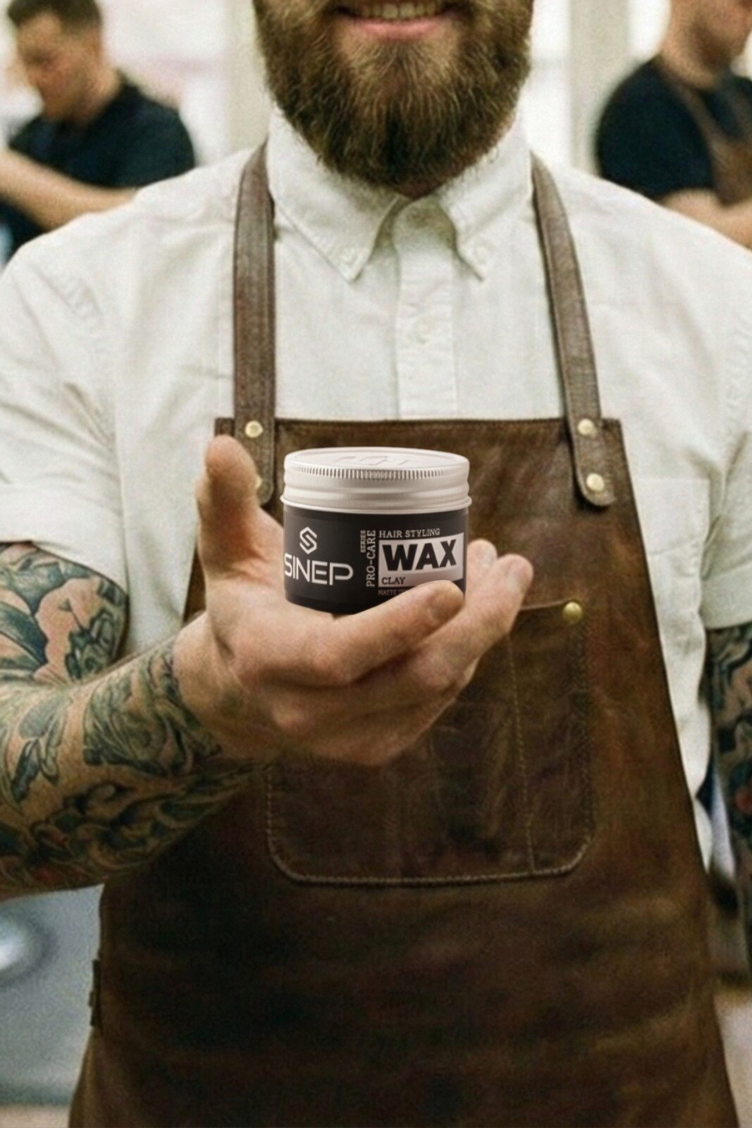 Barber holding a jar of SINEP Clay Wax