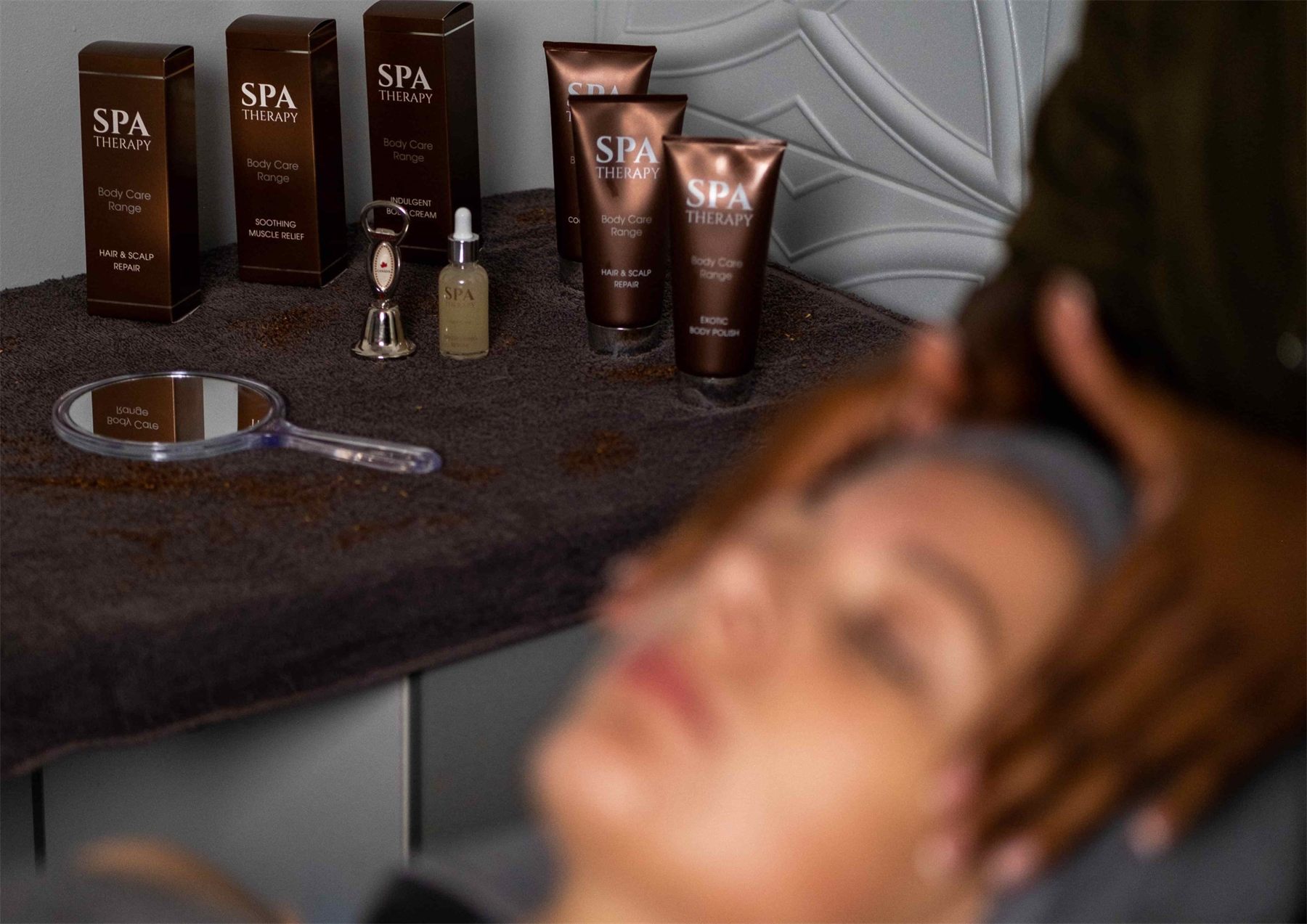 Client relaxing during a facial